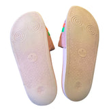 Gucci sandals with pink bottom of shoes on a white background