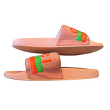 Pair of pink slides with colorful straps on a white background on their side 3