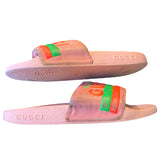 Pink Gucci slides with green and orange accents on a white background on their side 4