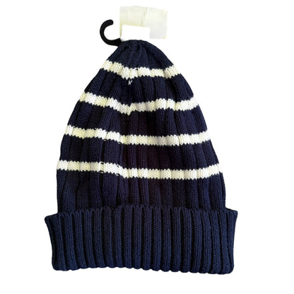 A navy blue and white striped knit beanie hat with a ribbed cuff, shown hanging from a black plastic hook with a white paper tag.