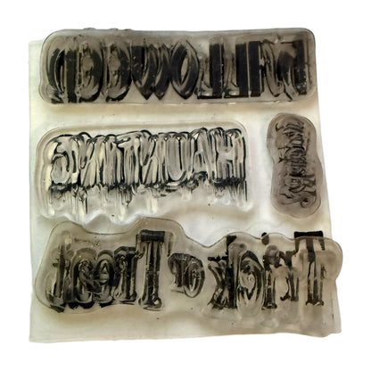 Clear rubber cling stamp with a Halloween theme on a white background. 