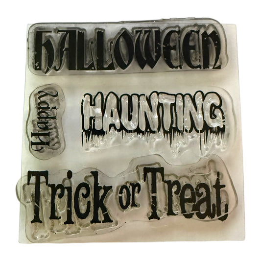 Set of 4 clear cling stamps with a Halloween theme on a white background. 