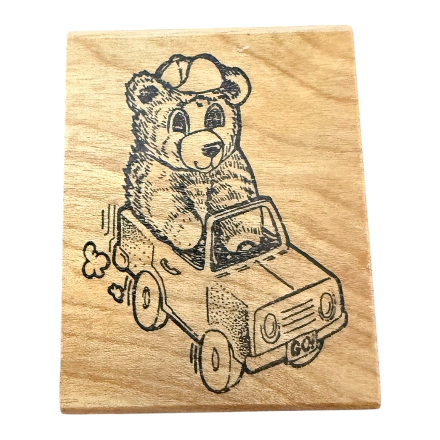 Wooden stamp with a bear driving a car design