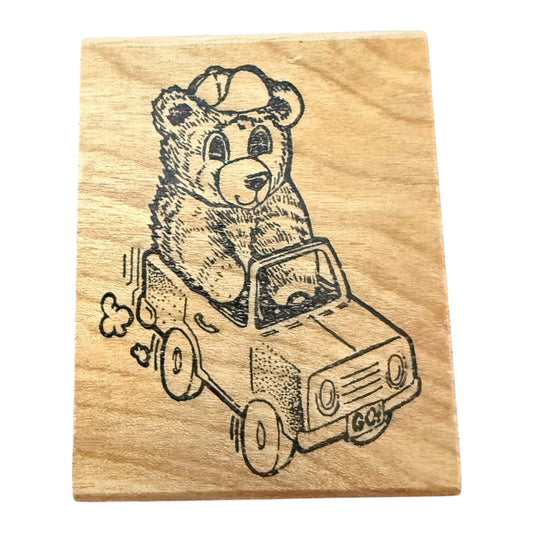 Wooden stamp with a bear driving a car design