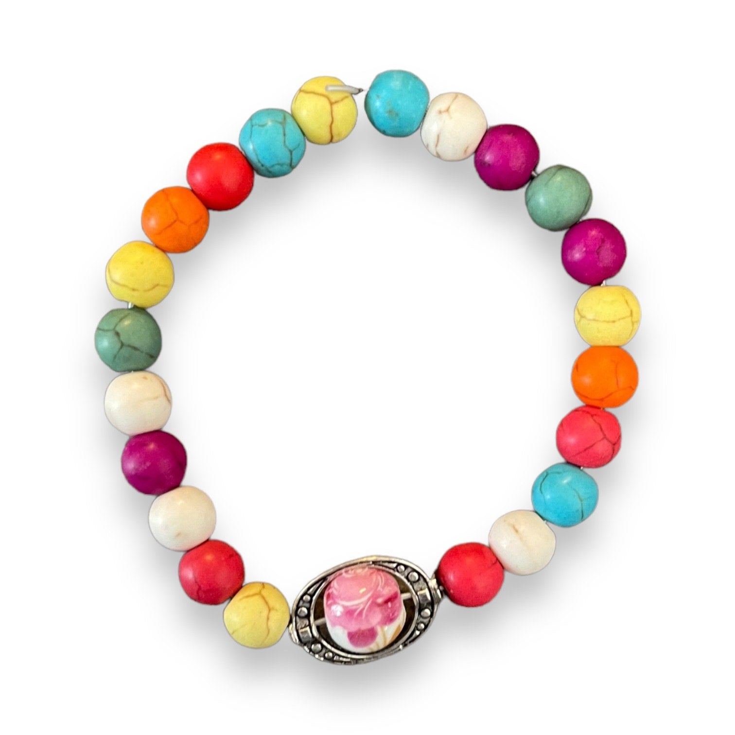Colorful beaded bracelet with a silver charm on a white background