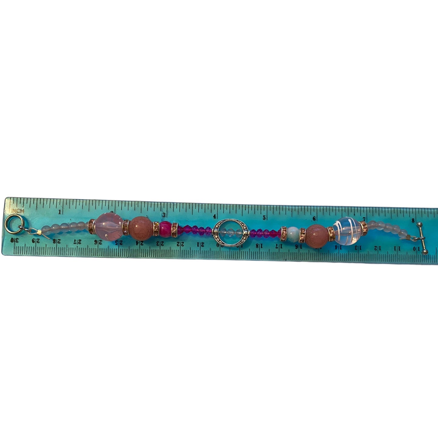 Bracelet with beads on a ruler for size reference