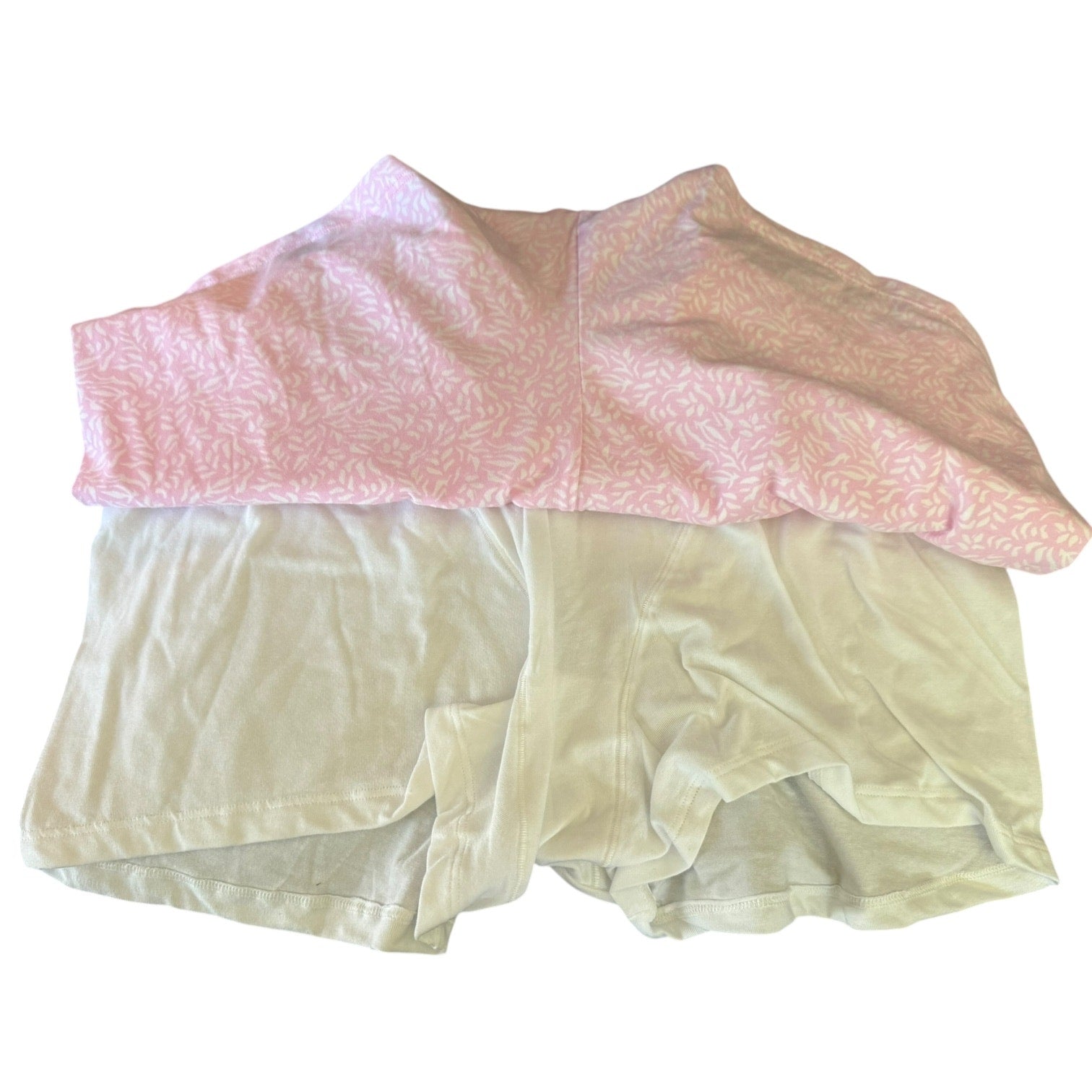 Pink and white boxer briefs on a white background