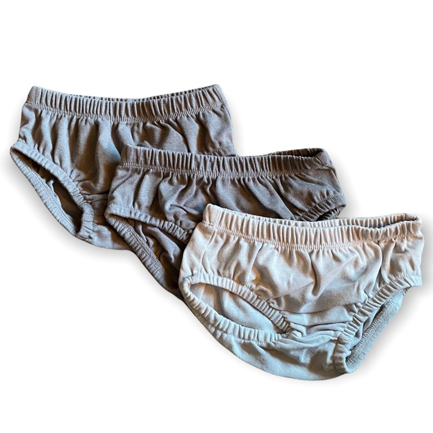 Front of 3 gray baby shorts