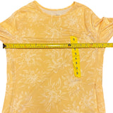 Pit to pit of yellow sun protection shirt