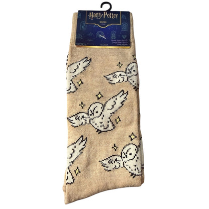 Front of Beige socks with owl designs on a white background