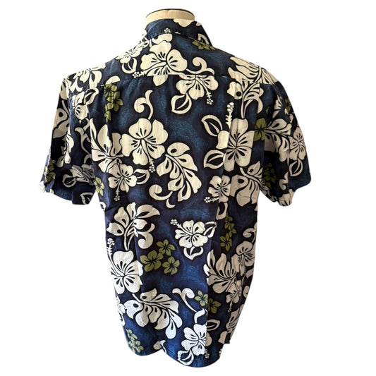 Back of Floral patterned shirt on a mannequin against a white background