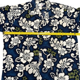 Floral-patterned shirt with a measuring tape on a blue background