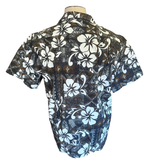 A short-sleeve button-up aloha print shirt on a mannequin torso.