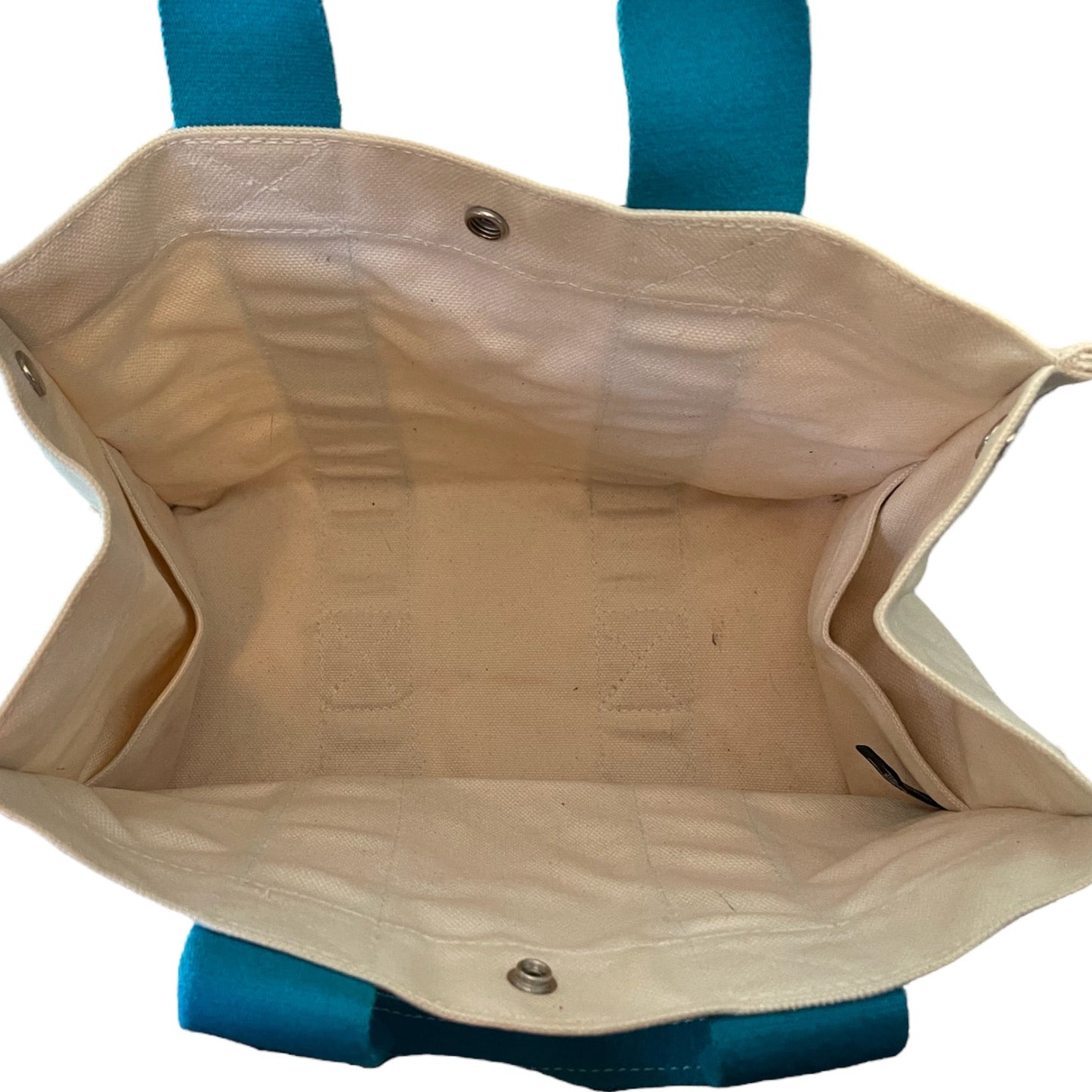 Interior of tote bag with blue accents on a white background