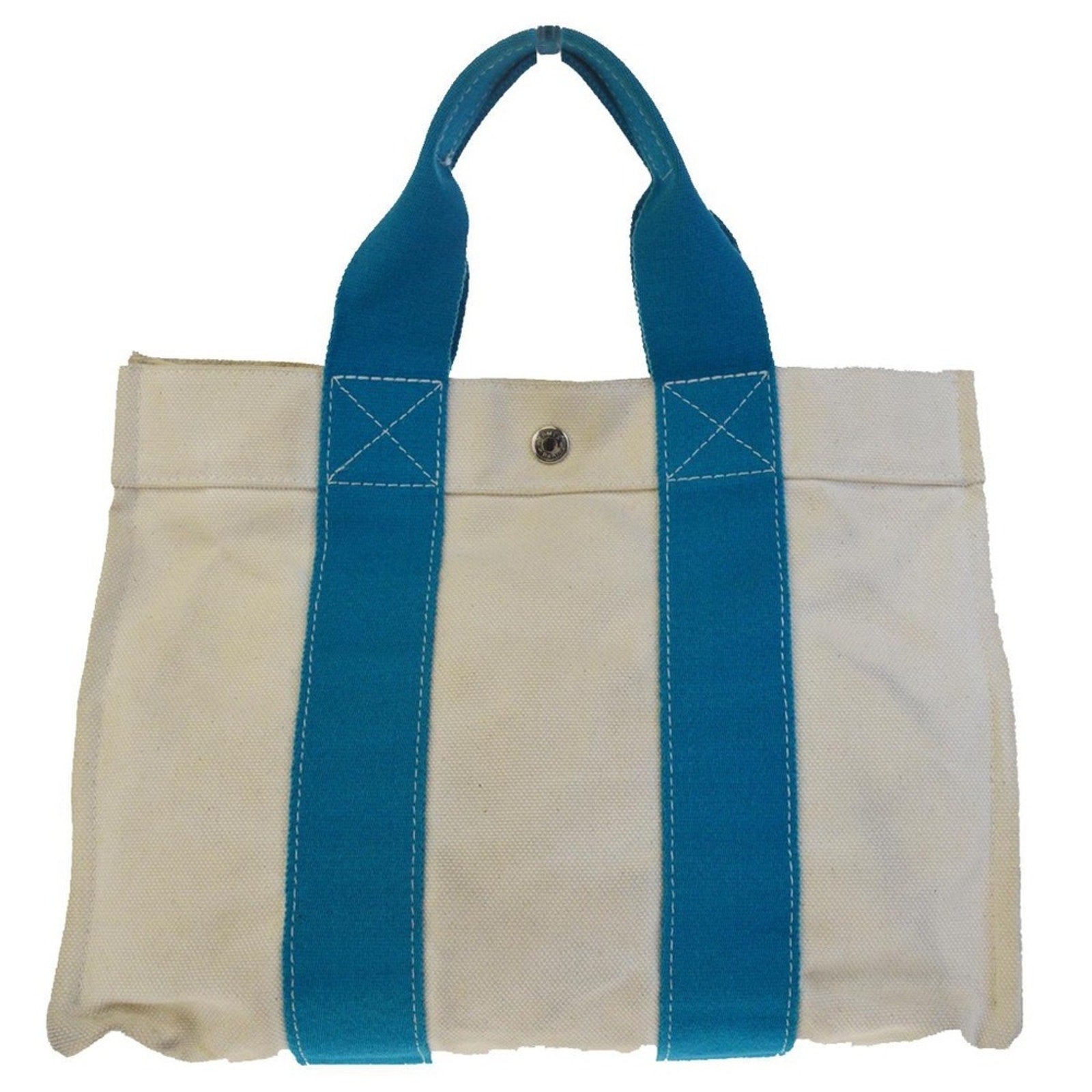 White tote bag with blue handles on a white background
