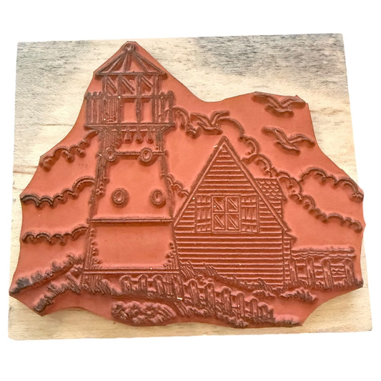 Decorative stamp with a house design on a wooden block