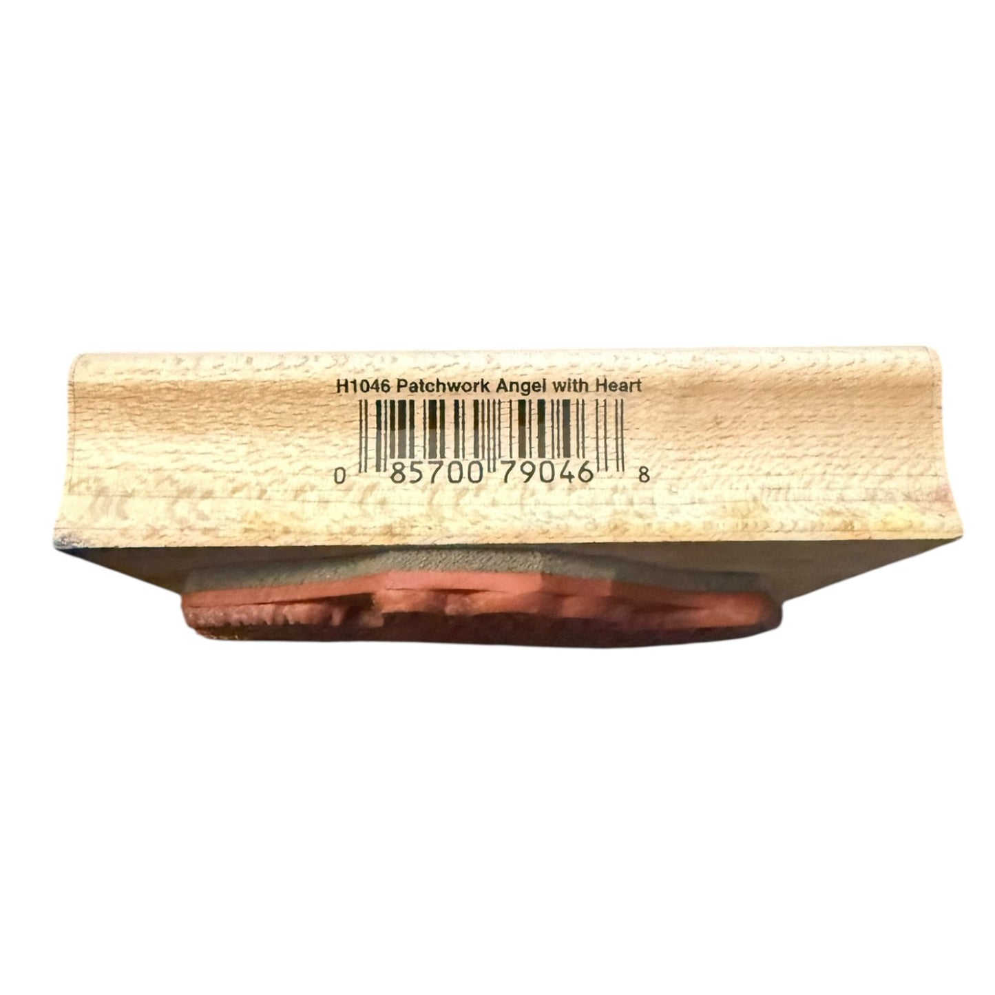 Wooden stamp with a patchwork angel design on a white background