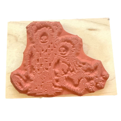 Decorative stamp with bear design on a wooden block