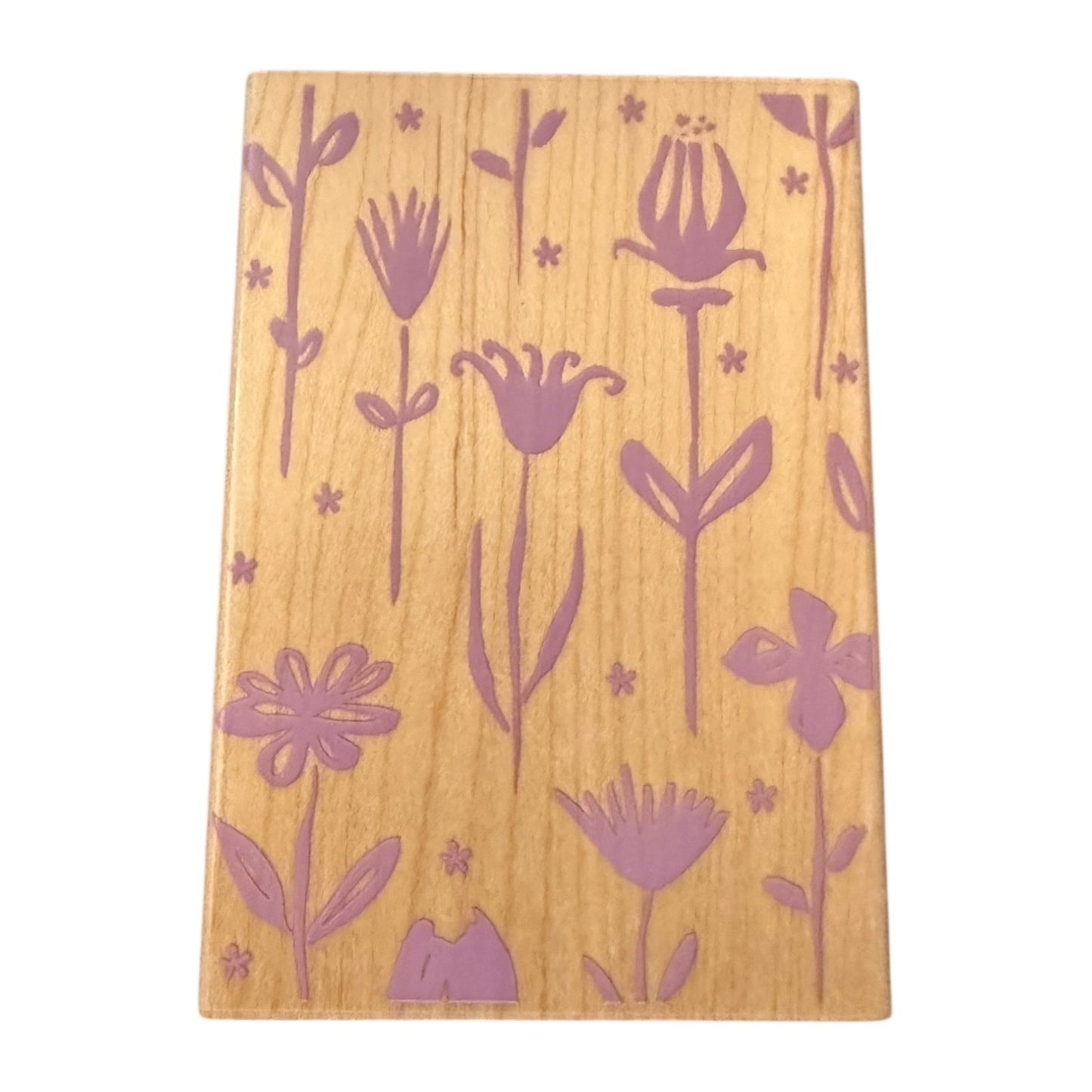 Wood stamp with purple floral patterns on a white background