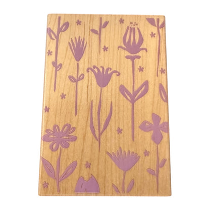 Wood stamp with purple floral patterns on a white background