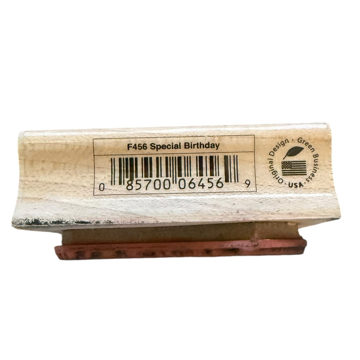 A wooden rubber stamp block with a printed barcode and text reading 'F456 Special Birthday' on the top, shown against a plain white background.