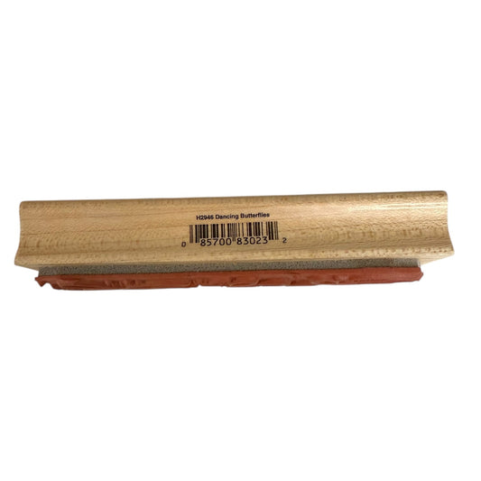 Wooden block with a barcode label on a white background