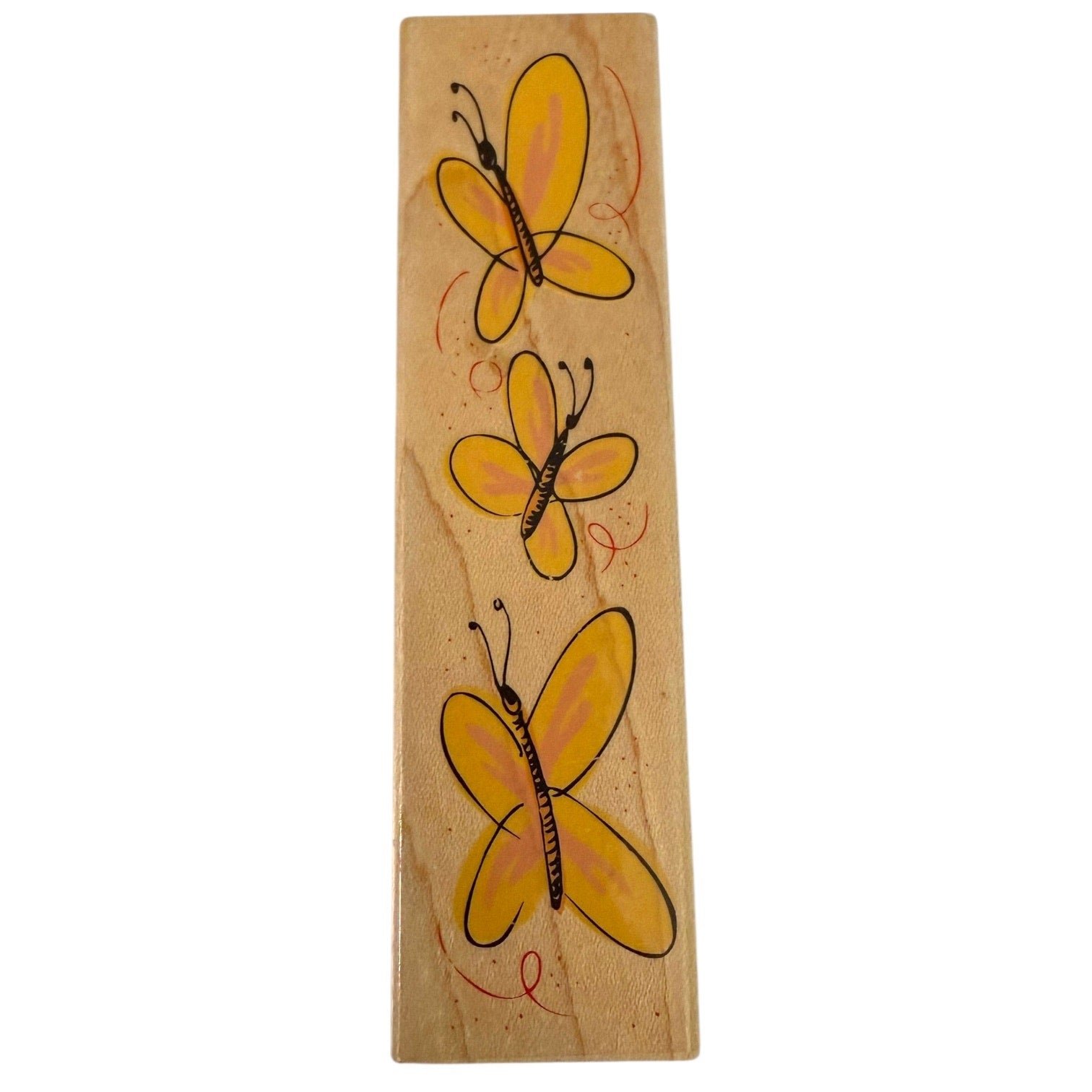 Wooden stamp with three yellow butterflies on a white background