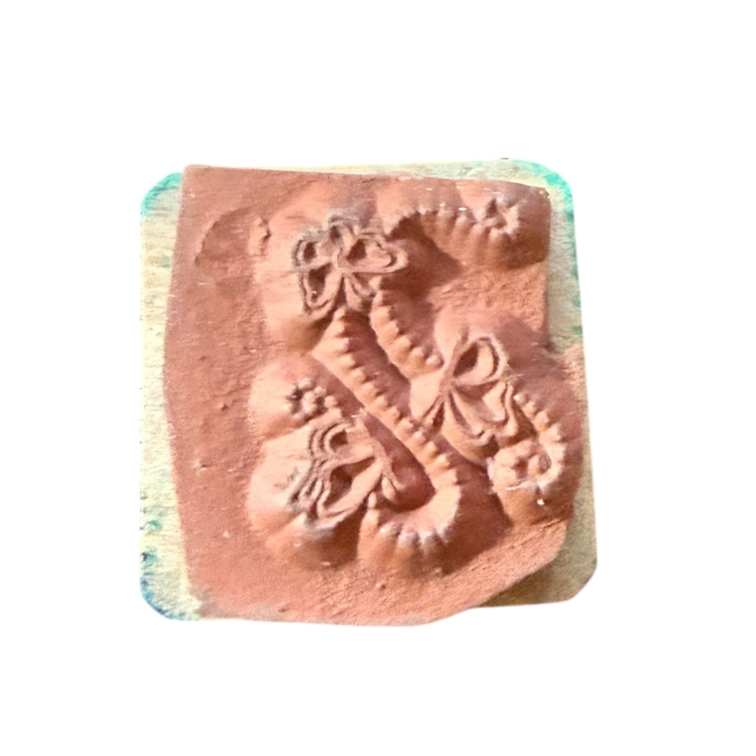 Rubber stamp with butterfly design on a white background