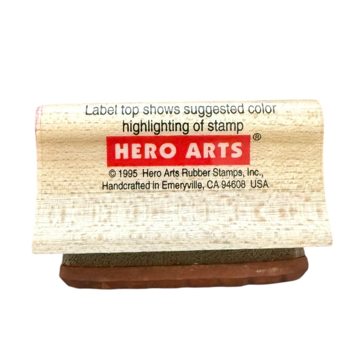 Hero Arts rubber stamp with beige handle and red label on a white background