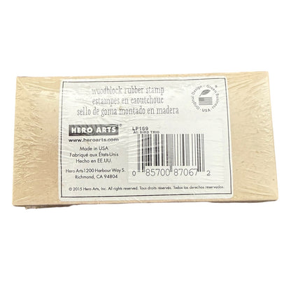 A Hero Arts woodblock rubber stamp in its original packaging, showing the back of the box with product details, a barcode, and a logo on a white background.