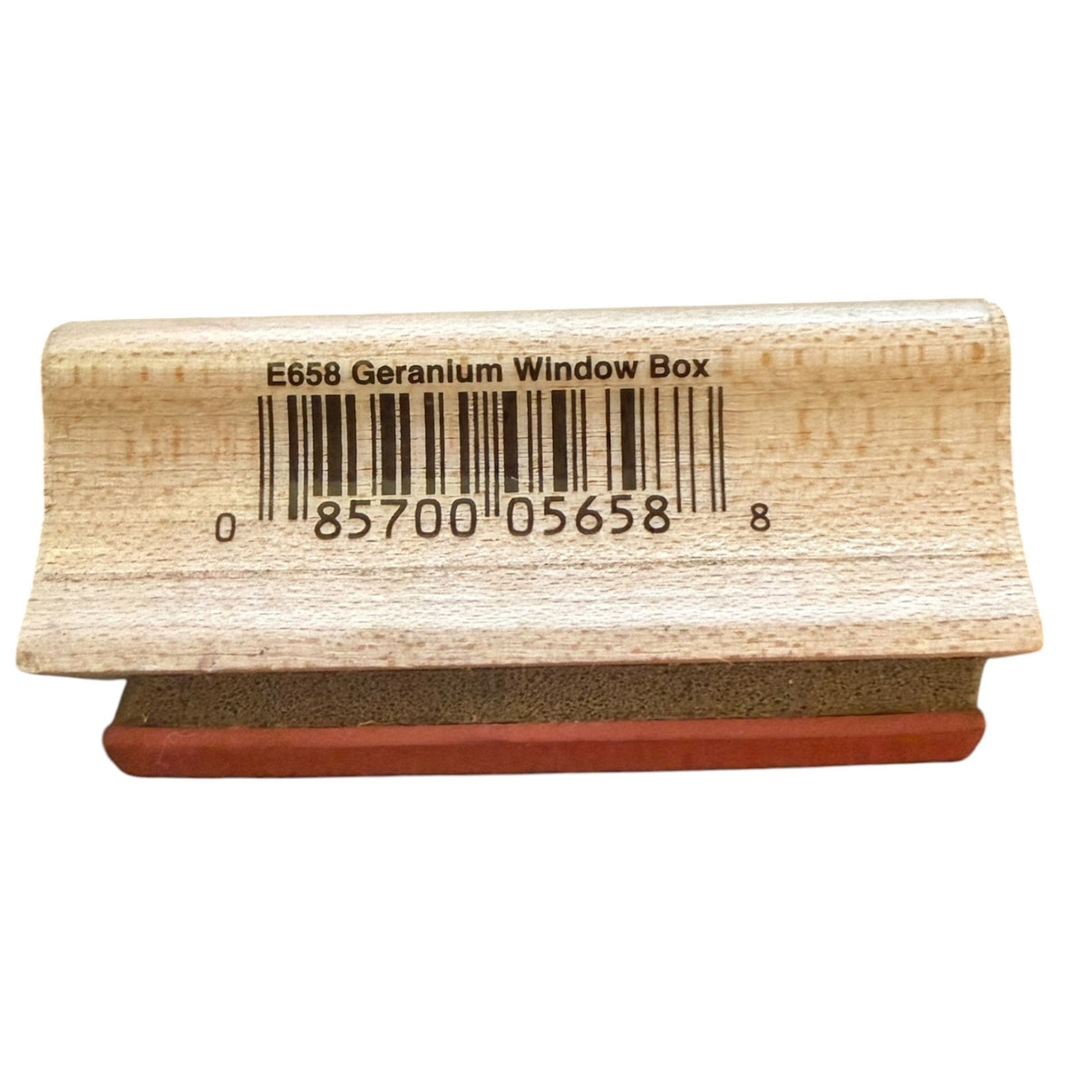 Wooden stamp with a barcode and text on a white background