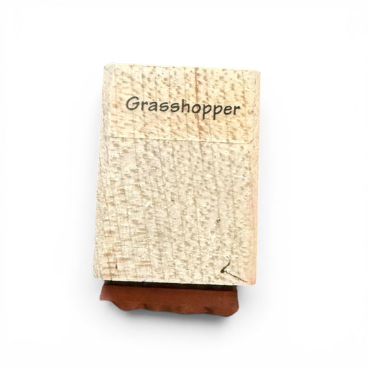 Wood block with 'Grasshopper' text on a white background