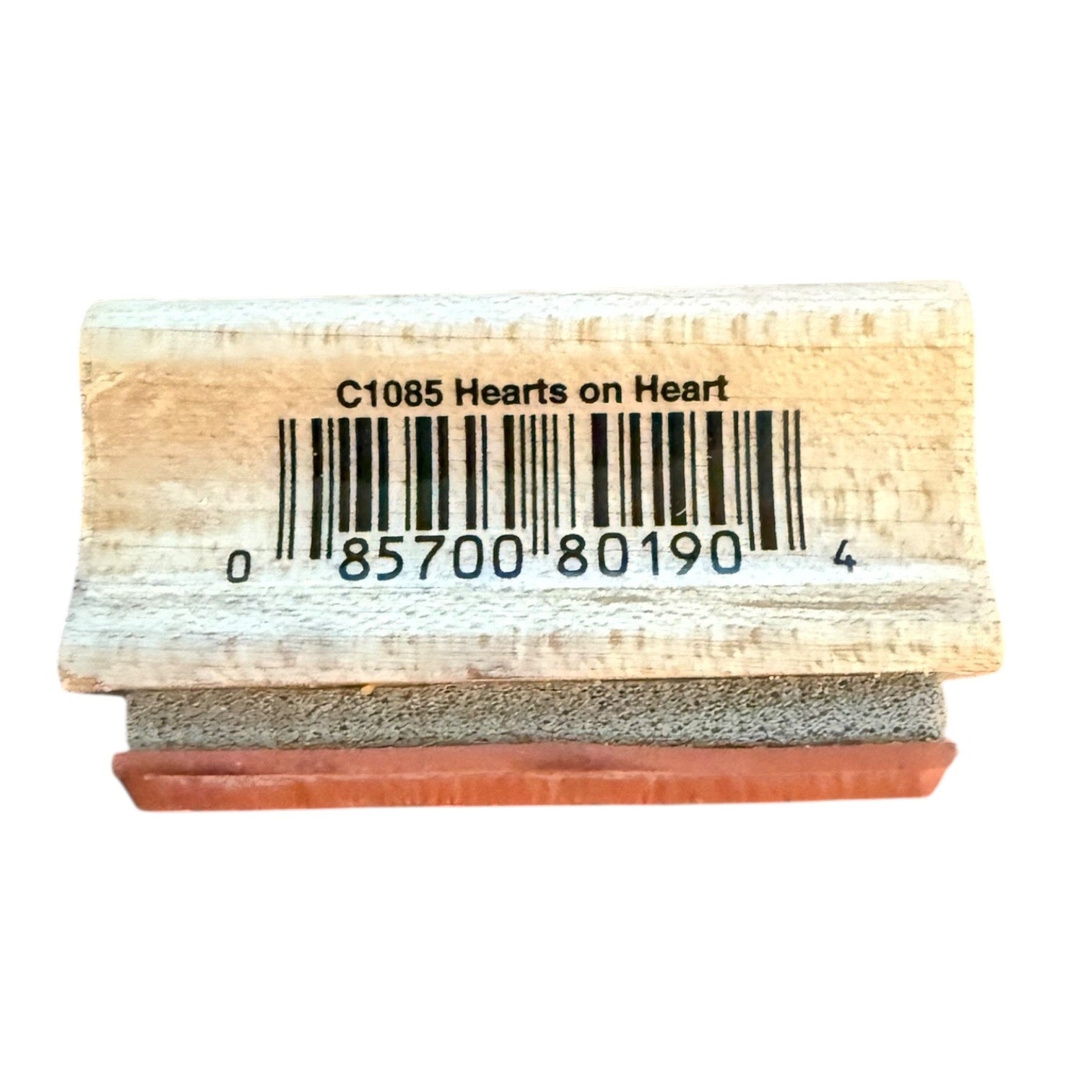 Rubber stamp with 'Hearts on Heart' text and barcode on a white background
