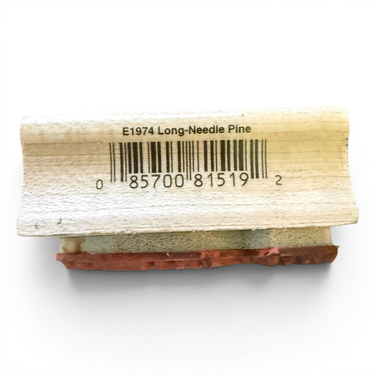 Wooden block with a barcode label on a white background