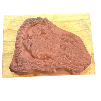 Rubber stamp with an otter design on a wooden block