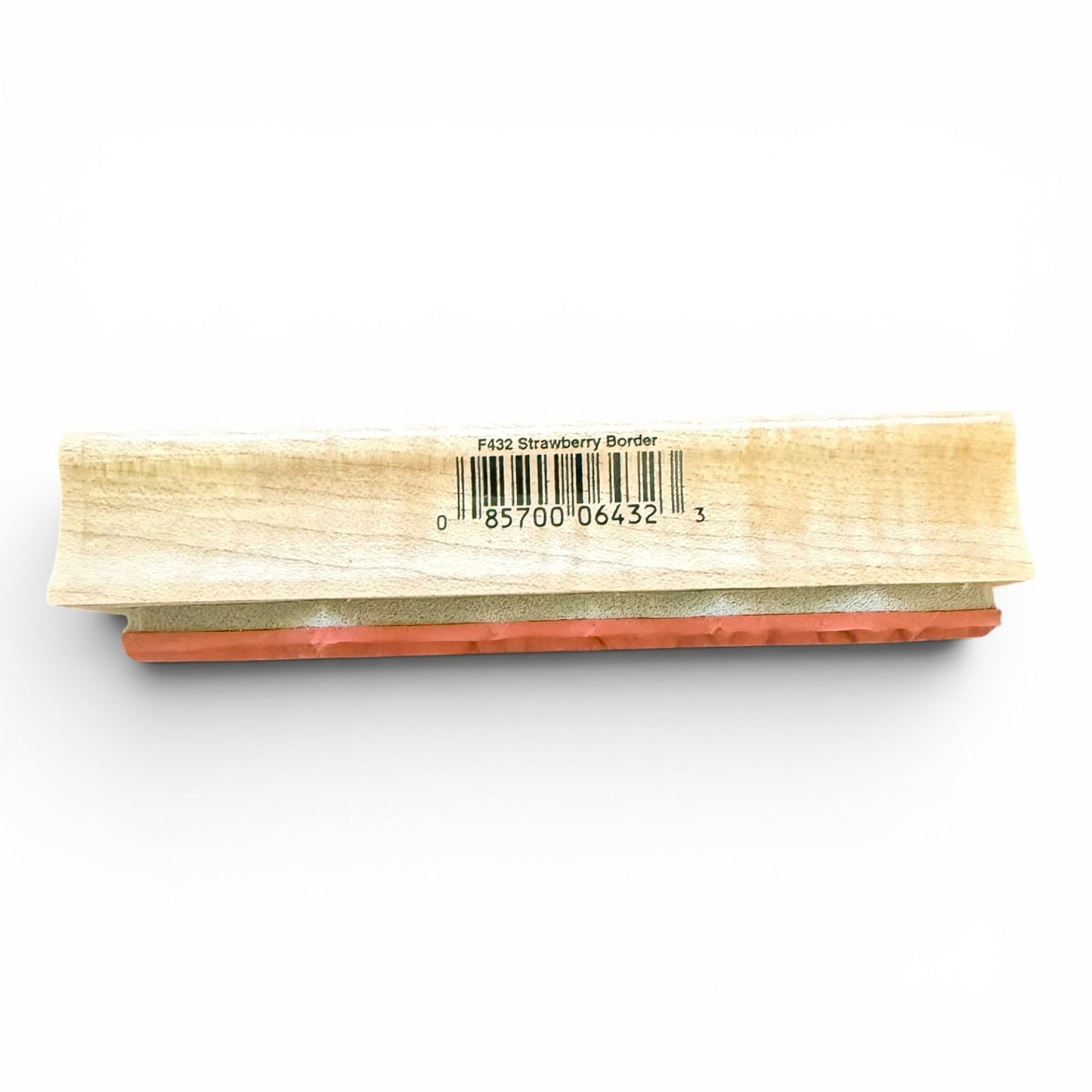 Wooden stamp with red pad on a white background
