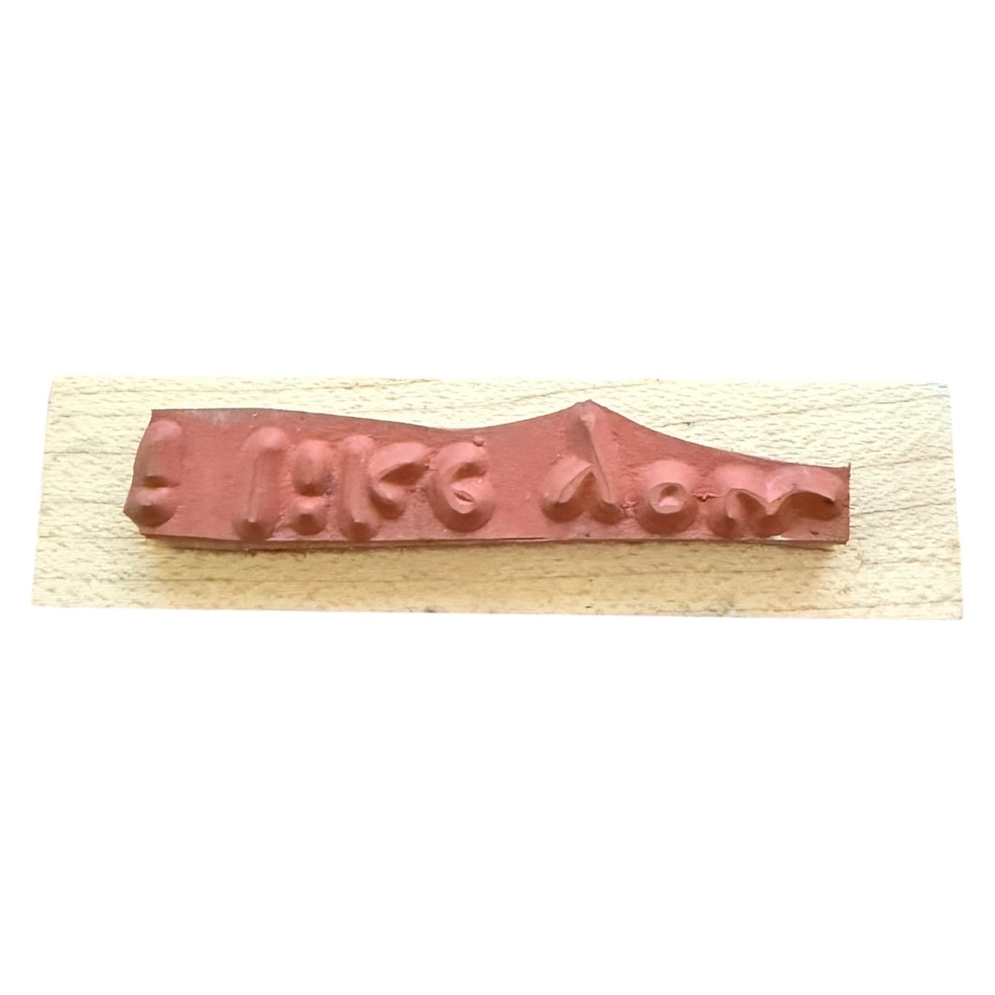 Wooden stamp with a rubber on a white background