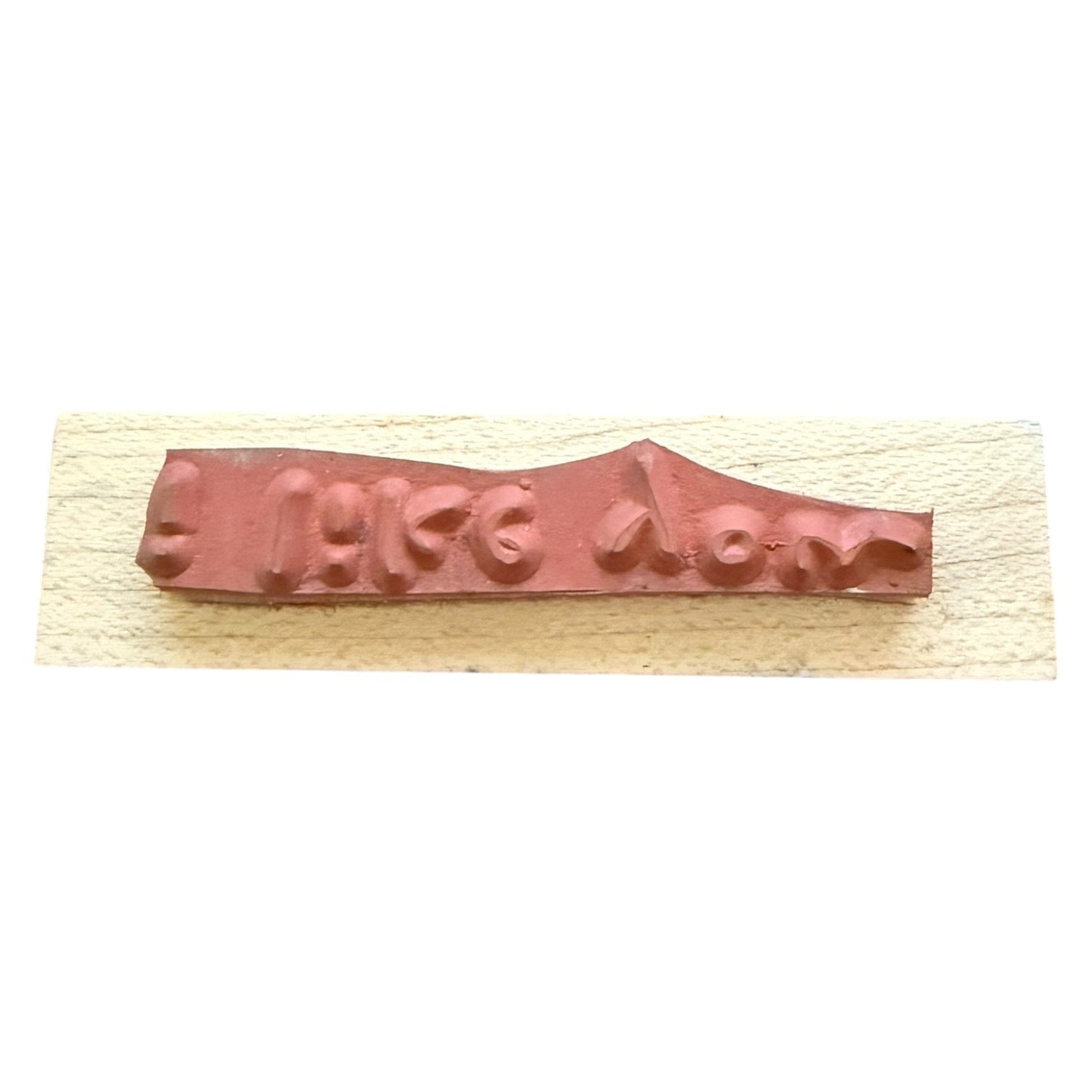 Wooden stamp with a rubber on a white background