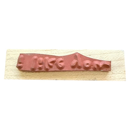 Wooden stamp with a rubber on a white background