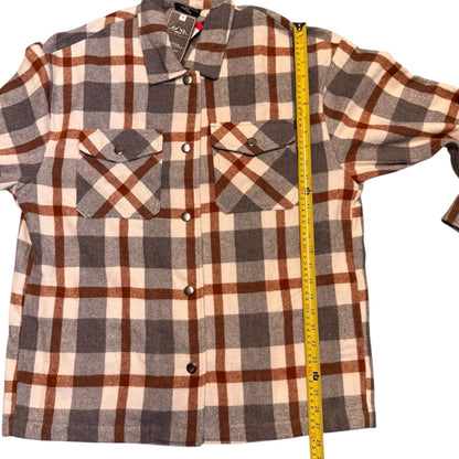 A long-sleeve plaid flannel, shown with a yellow tape measure running vertically along the side to indicate size.
