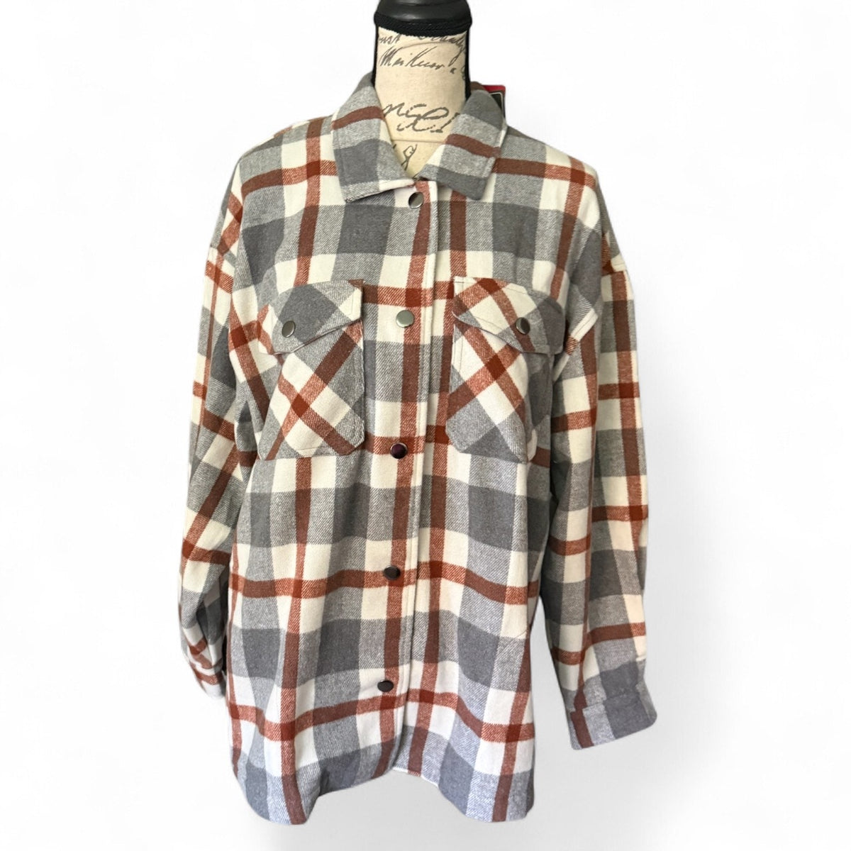 Front of flannel shacket on a mannequin on a white background. 