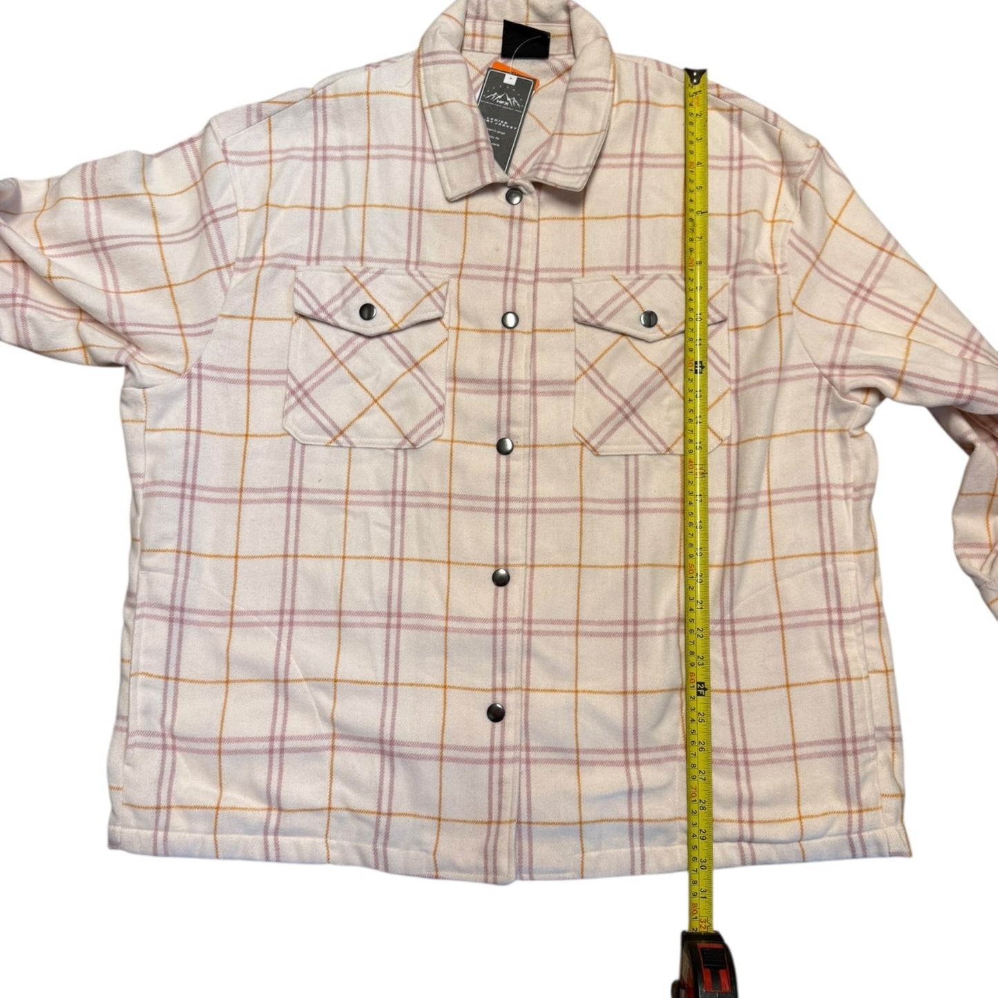 Plaid jacket with a measuring tape on a white background