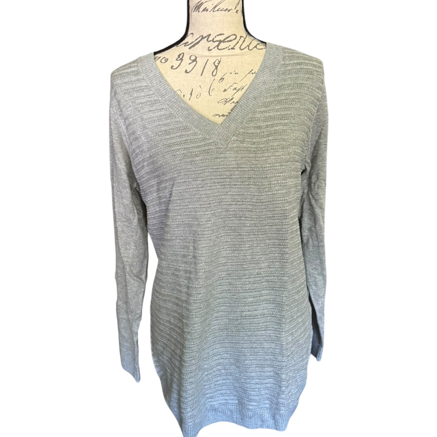 Front of Gray sweater on a mannequin with a white background