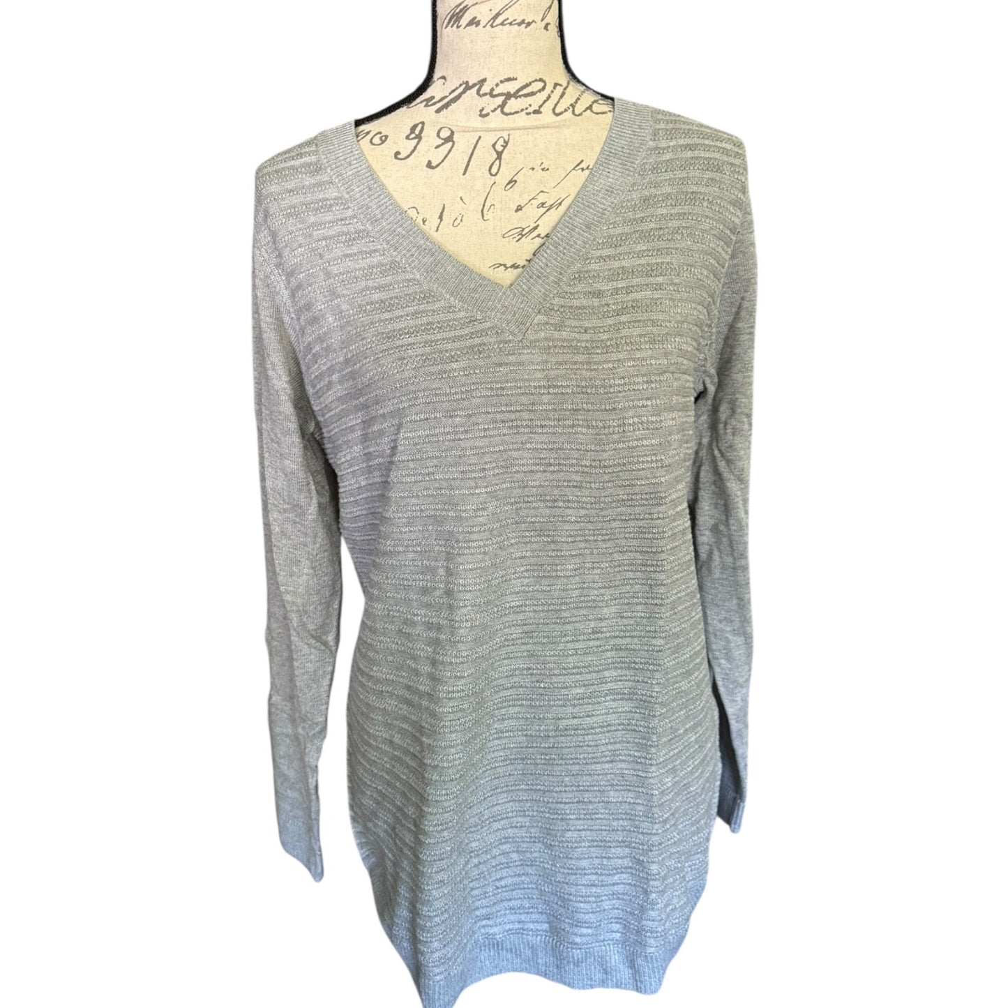 Front of Gray sweater on a mannequin with a white background