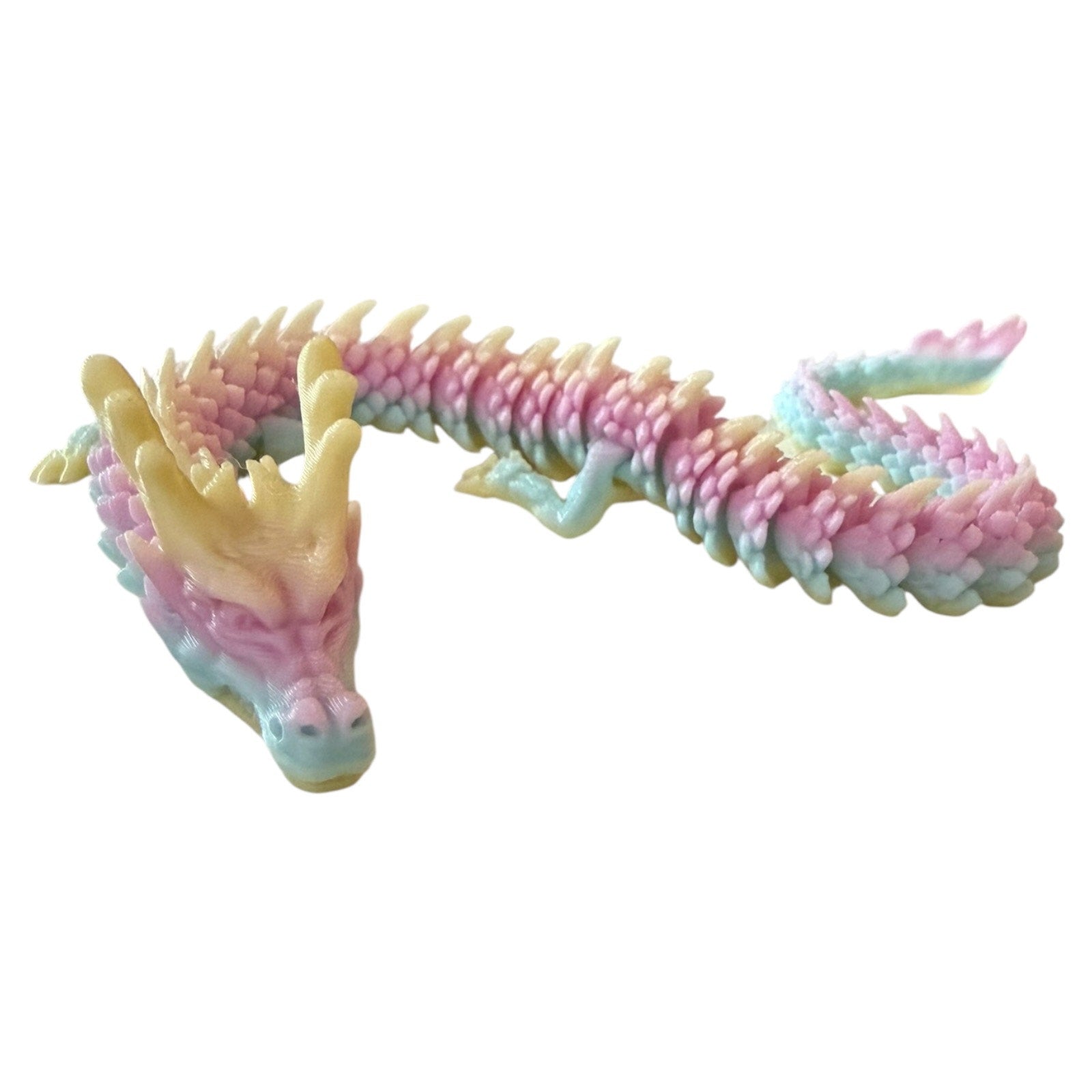Colorful dragon-shaped toy on a white background
