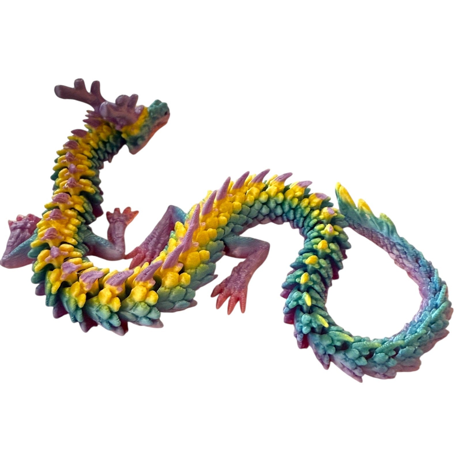 Colorful dragon toy figure on a white background