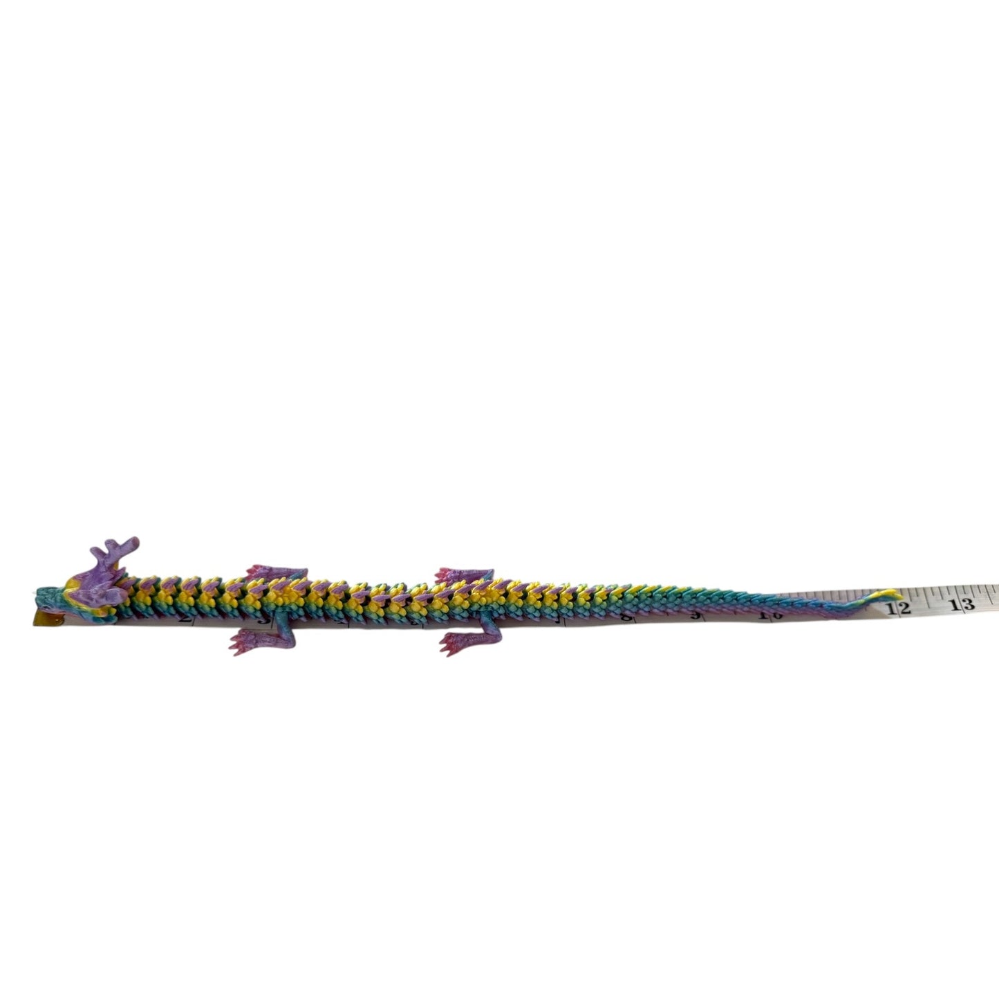 Colorful dragon on measuring tape on a white background