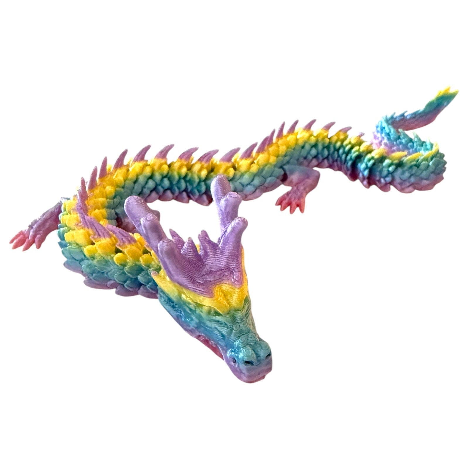 Colorful dragon-shaped toy on a white background