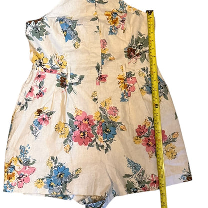 Floral jumper with a measuring tape on a white background