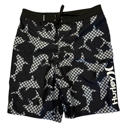 Black and white checkered shark patterned shorts on a white background